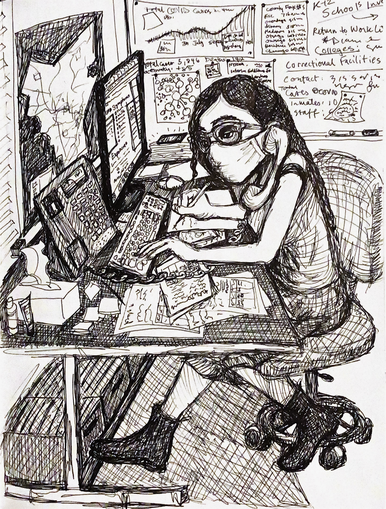 a woman sitting at a desktop computer with a phone held up by her shoulder so she can take notes with a pen and enter information into the computer at the same time. Maps on the wall and other information related to the COVID-19 public health response